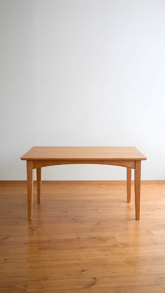 Dining Room table made from cherry, with elegant tapered legs and an arched apron